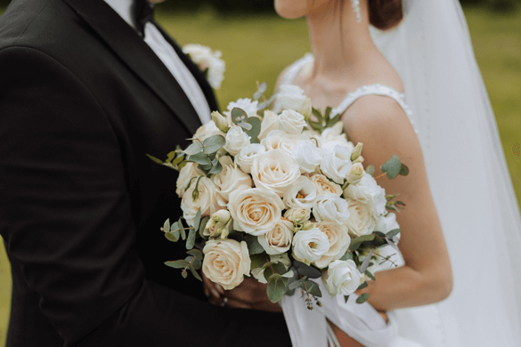 a bride and groom surrounded by their bridesmaids and groomsmen